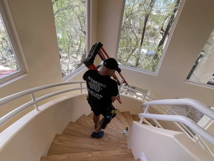 The Clean Guys team member carrying ladder in luxury Las Vegas home